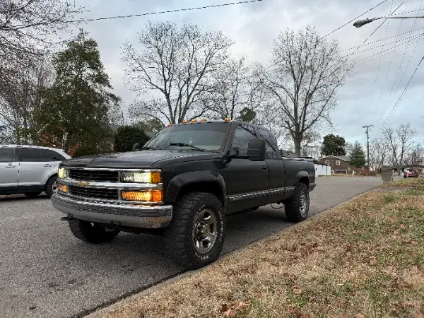 Black pickup truck parked on a residential street